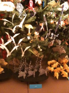 The base of the AMNH Origami Tree features groups of ring-tailed lemurs and flock of doves