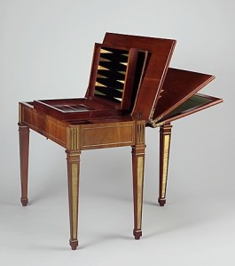 David Roentgen’s Game Table (ca. 1780–83). Oak, walnut, veneered with mahogany, maple, stained maple, holly, stained holly; felt; leather, partially tooled and gilded; iron and steel fittings; brass and gilt bronze mounts. Source: Metropolitan Museum, Pfeiffer Fund, 2007.