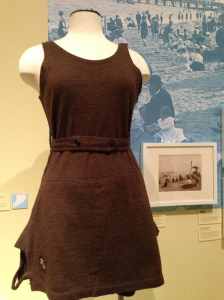 Installation view of woolen bathing suit (1905) and images of the 1890s Staten Island shore