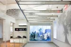 Installation view of the Pop Shop ceiling over the cash registers at NYHS, right behind a video wall of Oertel’s Pulling Down the Statue of King George III. Courtesy: NYHS/John Wallen