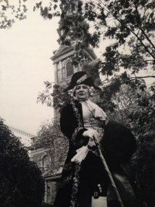 Editta poses for Bill  in embroidered frock coat and breeches  in front of St. Paul’s Chapel, the oldest church building (1766) in Manhattan