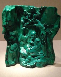 Converse had to have this tiny green malachite sculpture of a teacher seated in a grotto. 