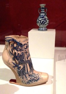 Gaultier’s 2012 Nude Tattoo Boot displayed next to its inspiration, a Chinese porcelain Ming vase (1573-1619)