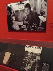 Photo of Dylan at Kettle of Fish Bar at 114 MacDougal Street in 1964 above his sheet music 